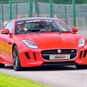 Red Jaguar F Type driving on the track